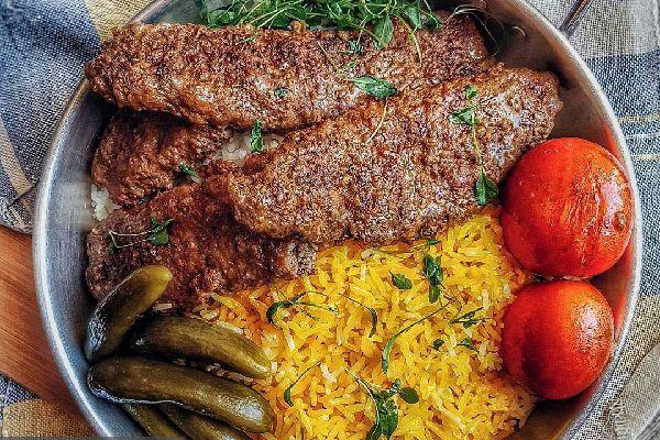 Iranian Kebab Tabeh or pan kebab with rice and tomato